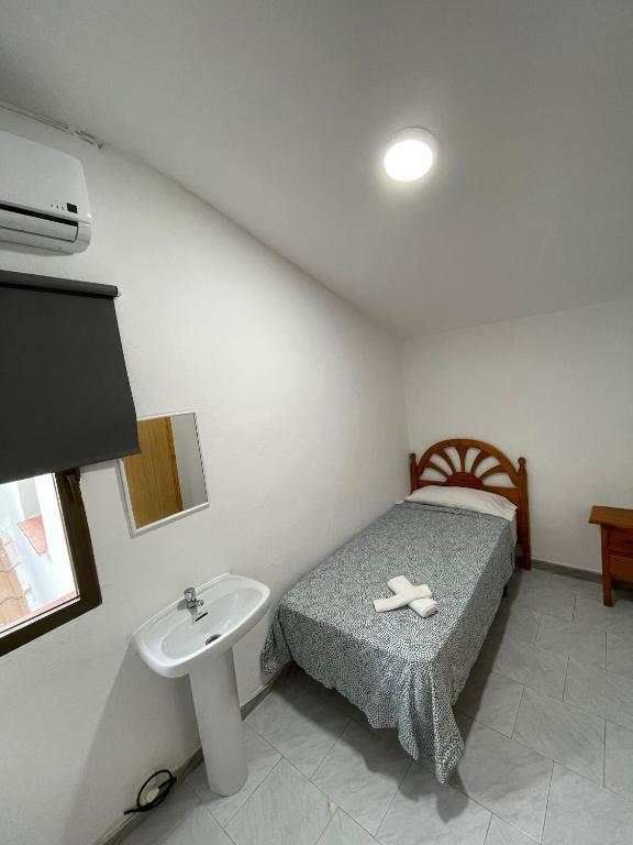Posteľ alebo postele v izbe v ubytovaní Hostal La Campiña