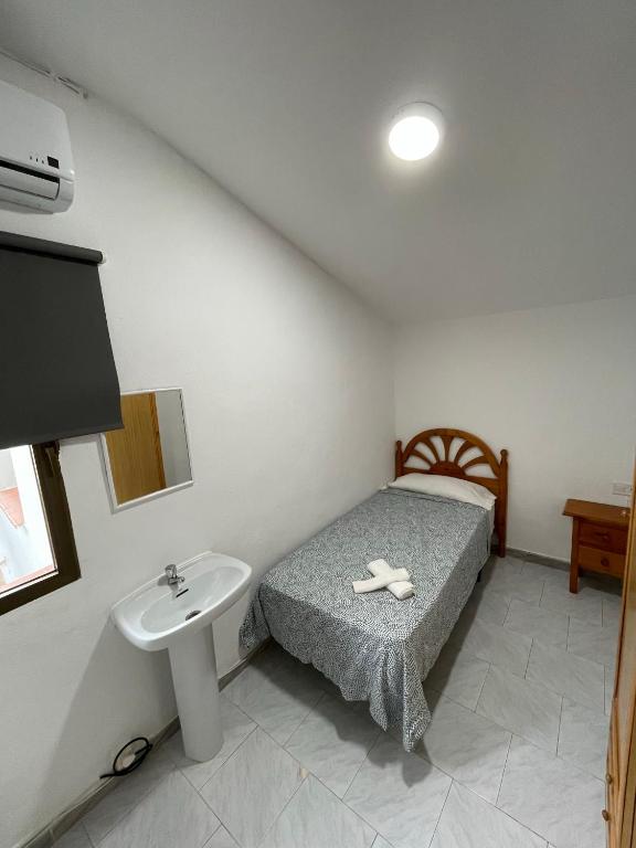 Posteľ alebo postele v izbe v ubytovaní Hostal La Campiña