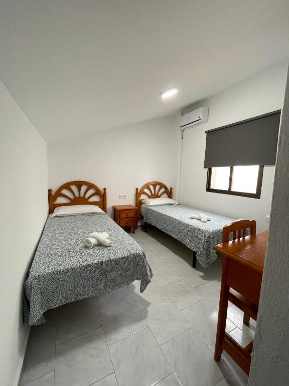 Posteľ alebo postele v izbe v ubytovaní Hostal La Campiña