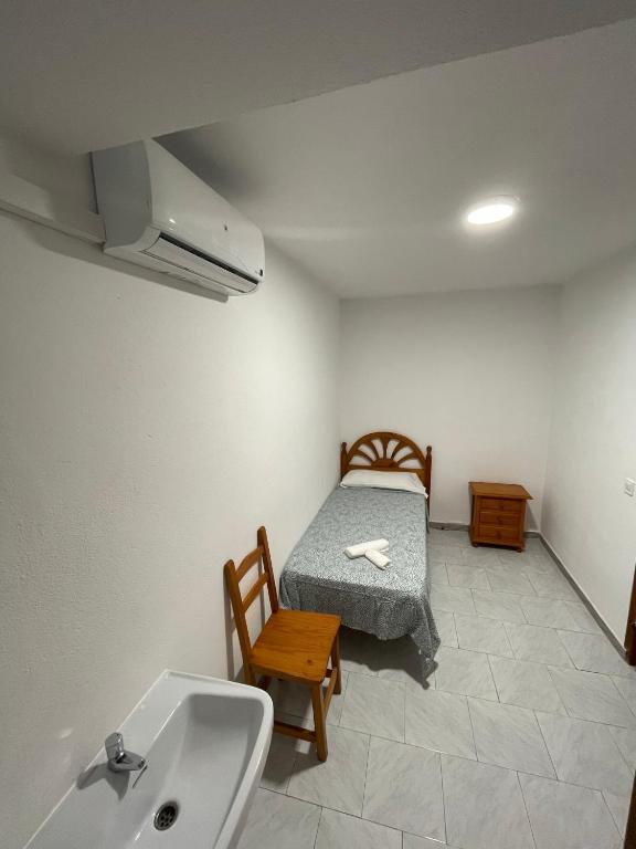 Posteľ alebo postele v izbe v ubytovaní Hostal La Campiña