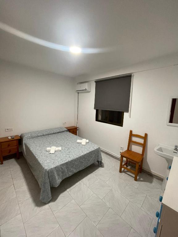 Posteľ alebo postele v izbe v ubytovaní Hostal La Campiña