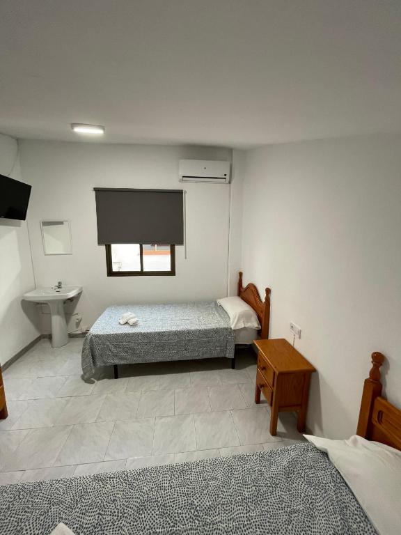 Posteľ alebo postele v izbe v ubytovaní Hostal La Campiña