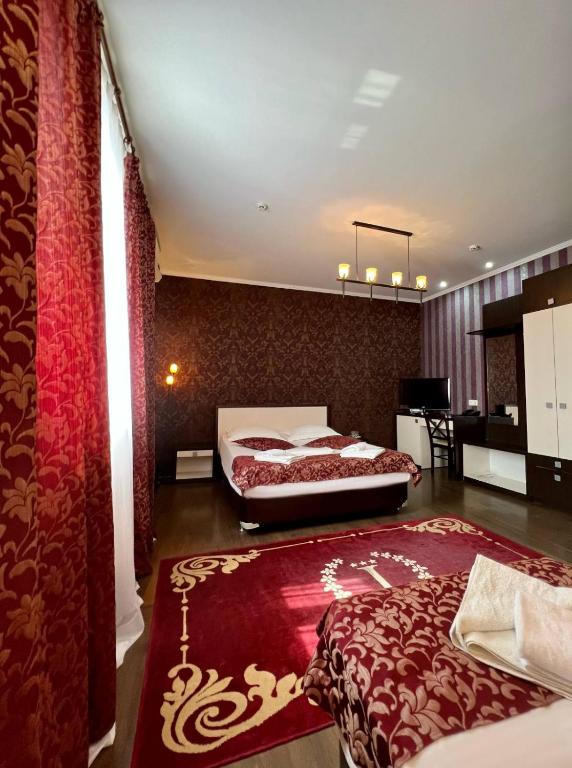 Postel nebo postele na pokoji v ubytování IRIS Hotel