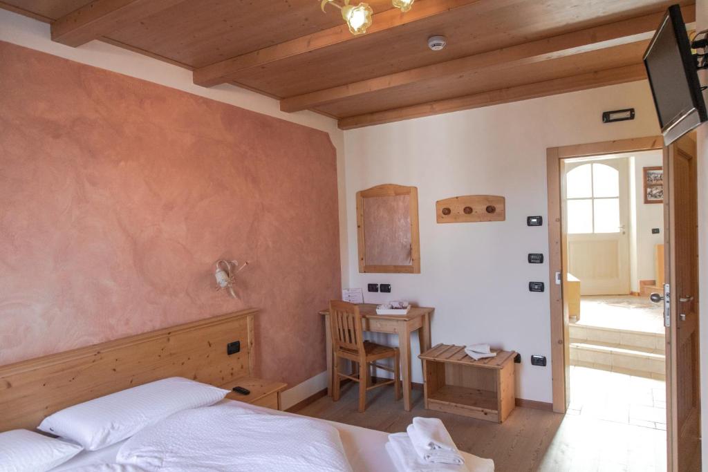 Postel nebo postele na pokoji v ubytování Agritur Sandro