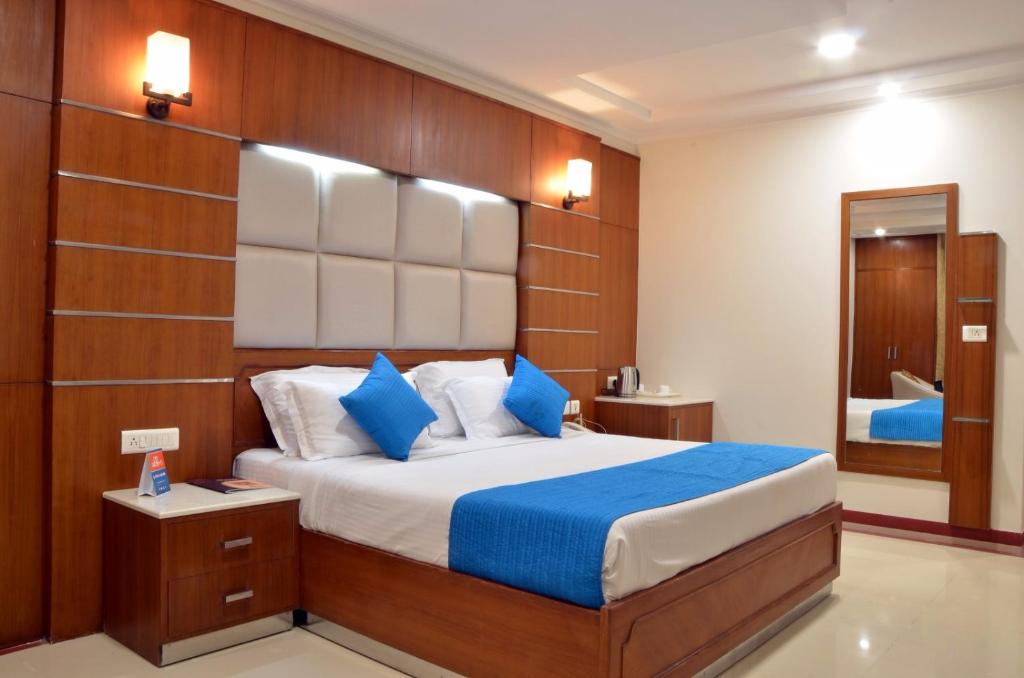 Postel nebo postele na pokoji v ubytování Hotel Bhoomivilas
