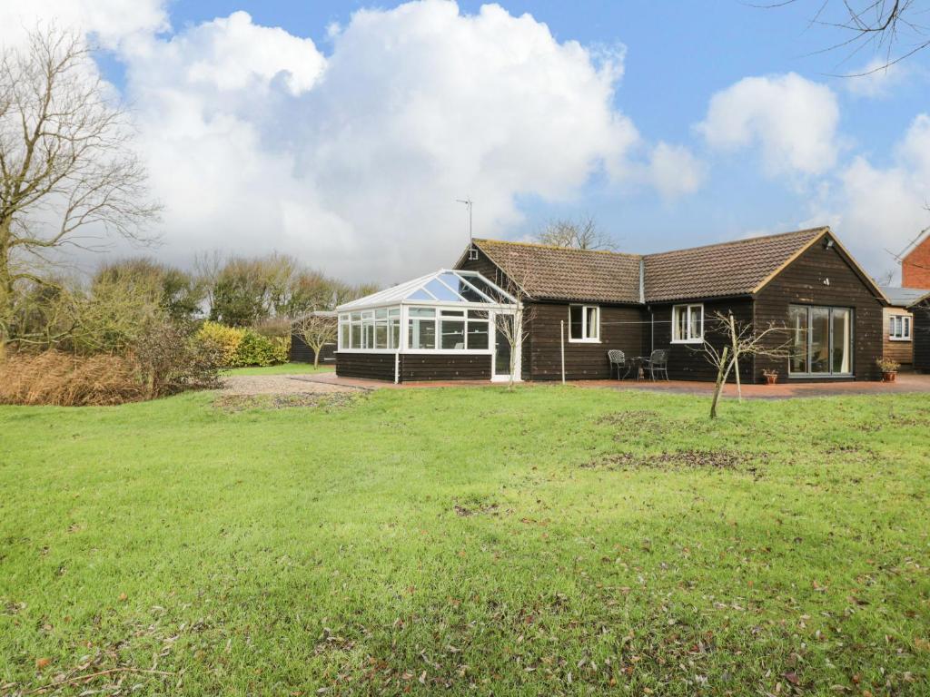 a house with a large yard in front of it at The Annex in Swindon