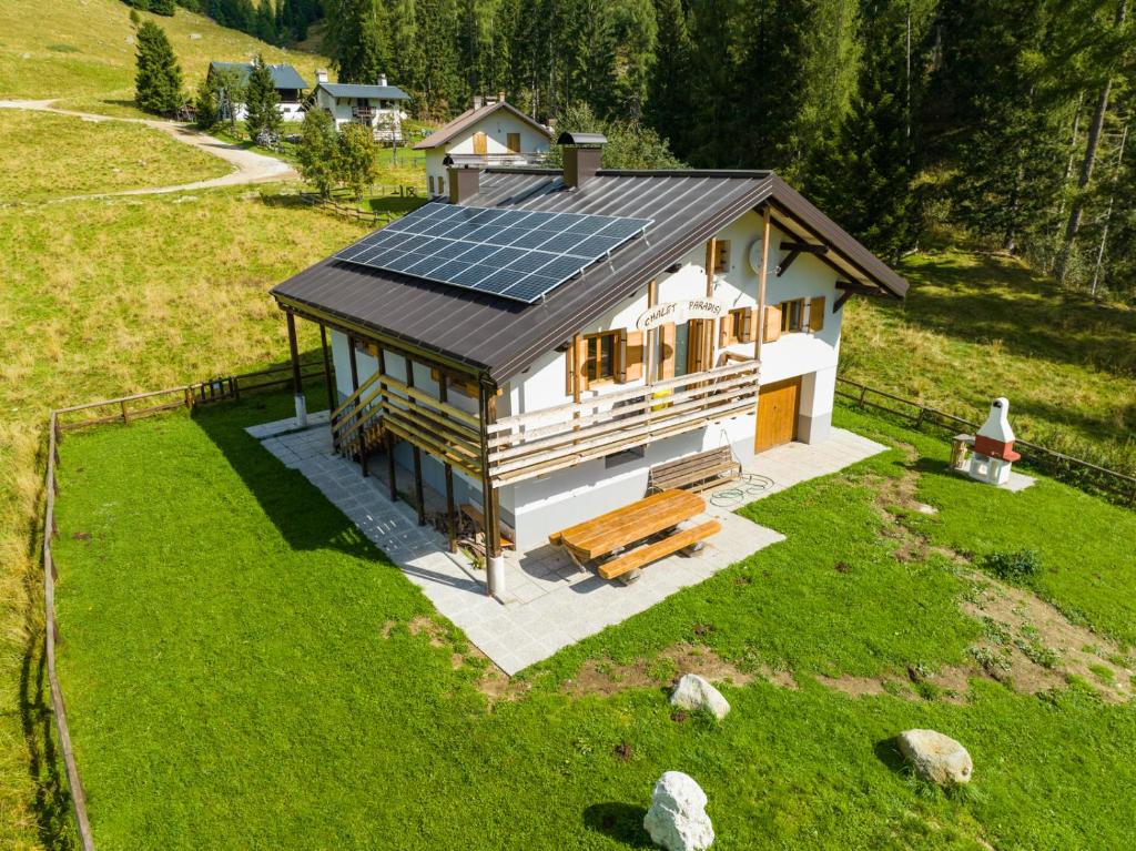 an overhead view of a house with solar panels on it at Chalet Paradisi in Castello Tesino
