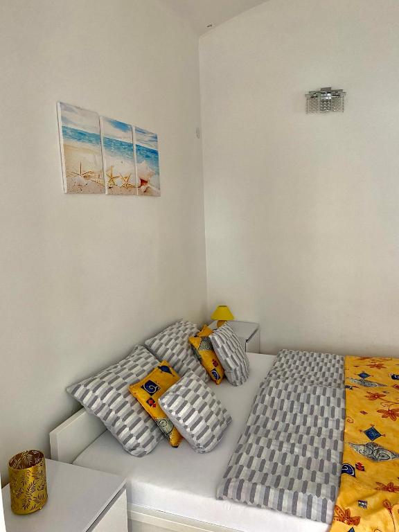 Кровать или кровати в номере Grande Familia Apartman