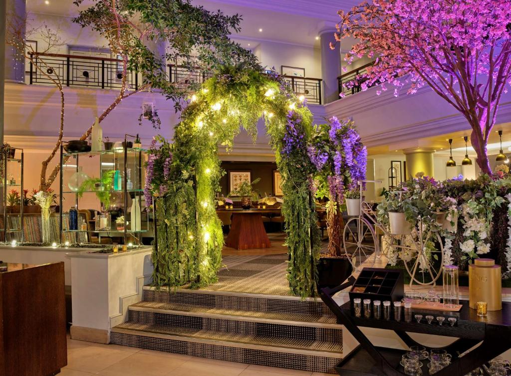 an arbor with flowers and lights in a store at Hyatt Regency Birmingham in Birmingham