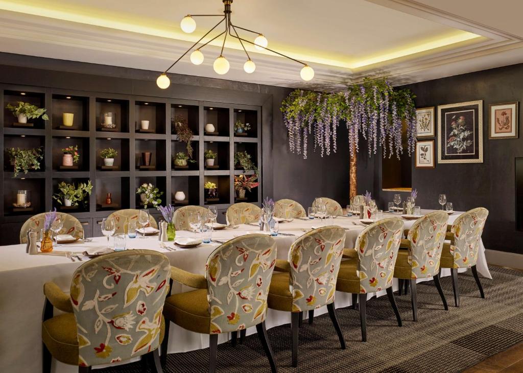 a dining room with a long table and chairs at Hyatt Regency Birmingham in Birmingham
