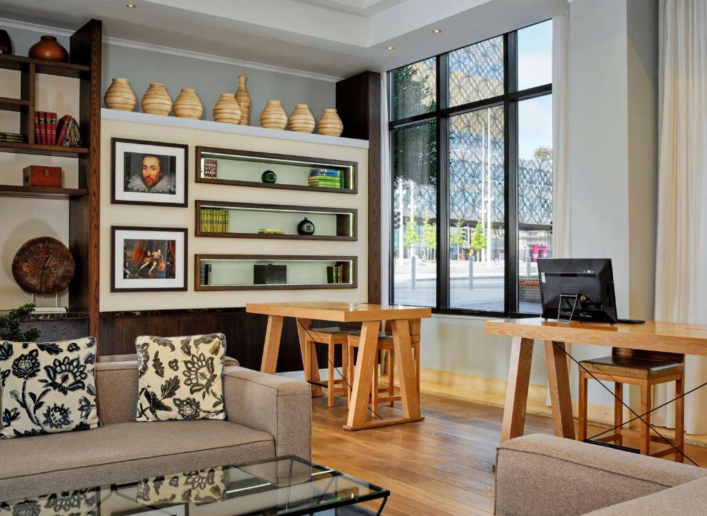 a living room with a couch and a table at Hyatt Regency Birmingham in Birmingham