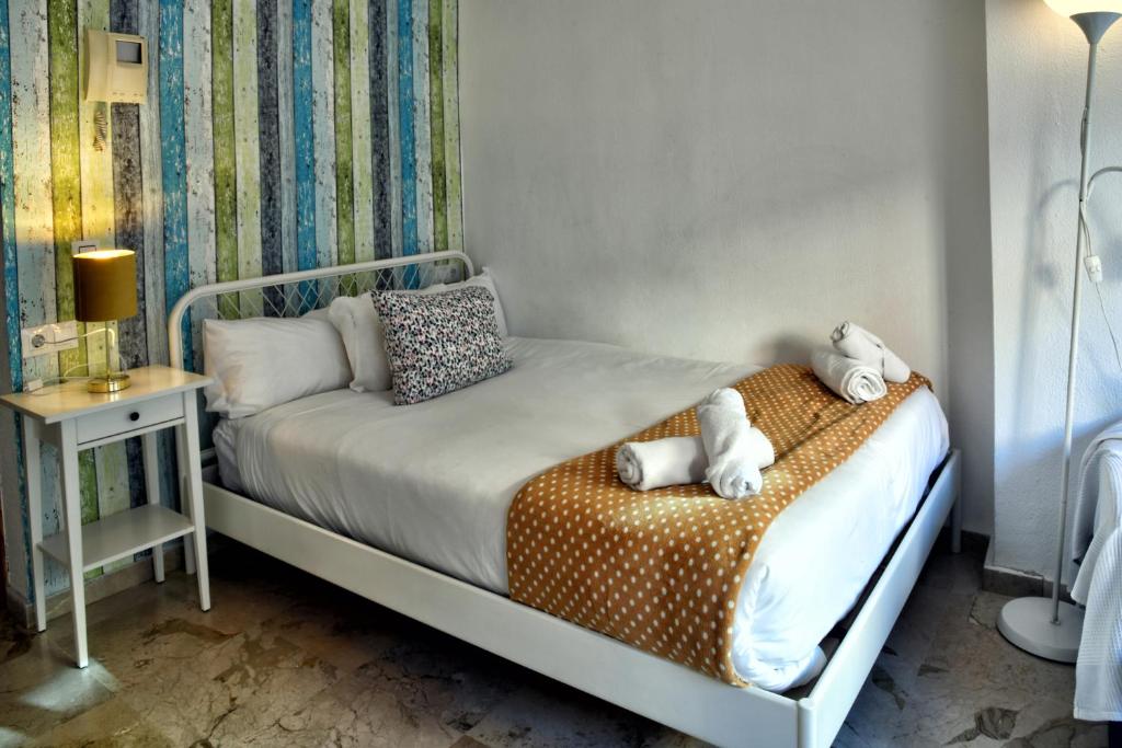 Posteľ alebo postele v izbe v ubytovaní WonderStays Apartamentos Vela