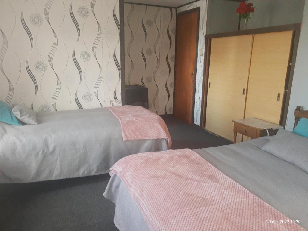 Postel nebo postele na pokoji v ubytování Hostal Klein