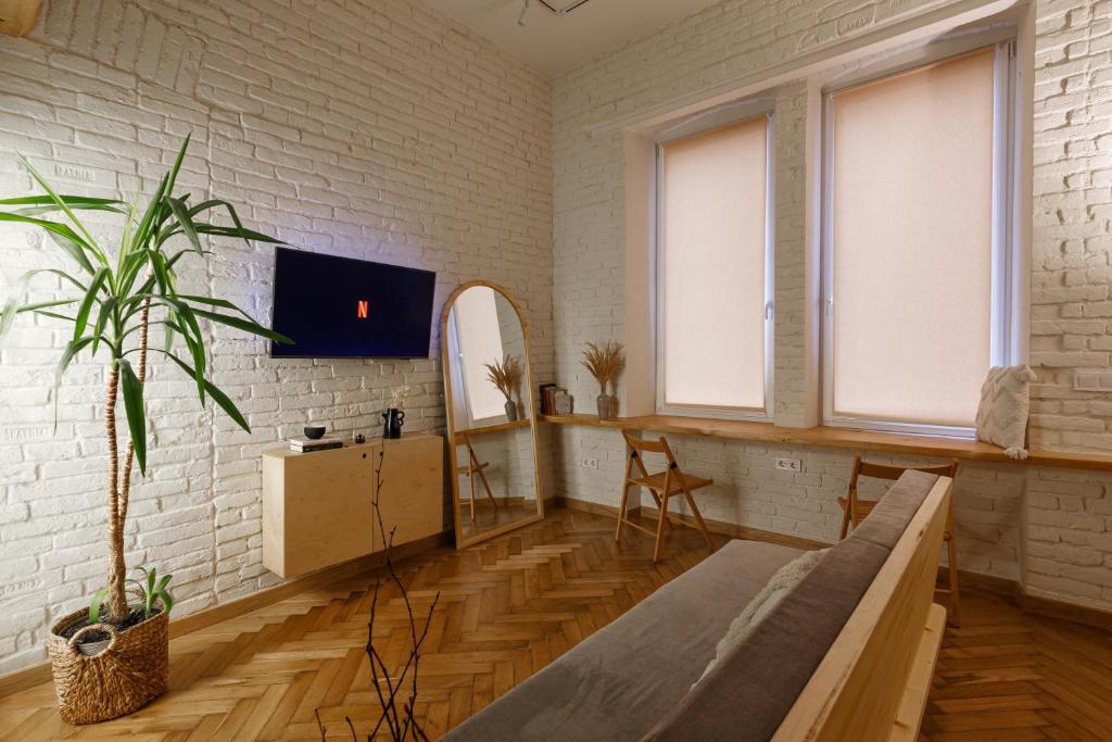 TV a/nebo společenská místnost v ubytování Passage Apartment