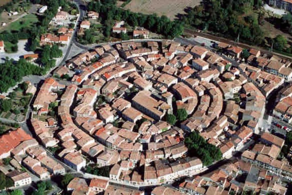 an aerial view of a city with houses at Maison atypique dans circulade in Bram