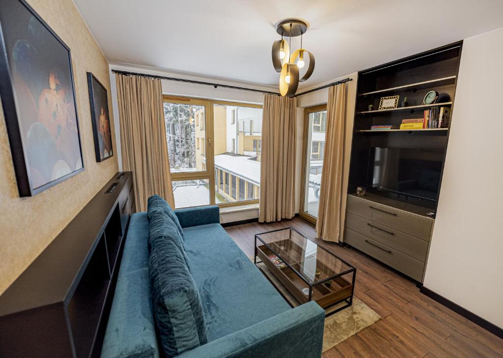 Televízia a/alebo spoločenská miestnosť v ubytovaní Apartament Kilińskiego 17a,2