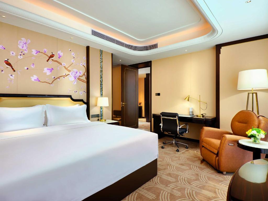 Postel nebo postele na pokoji v ubytování The Yun Hotel Foshan Nanhai-Near Pazhou Complex
