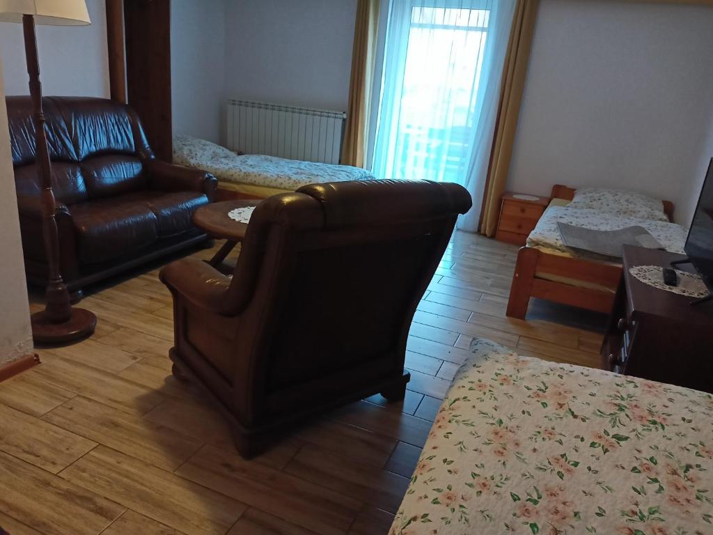 Łóżko lub łóżka w pokoju w obiekcie Willa Rosa