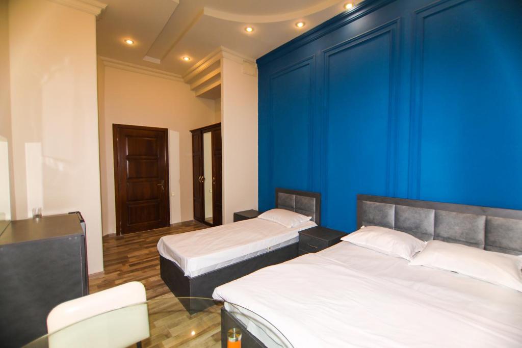 Postel nebo postele na pokoji v ubytování NEW BELLA HOTEL