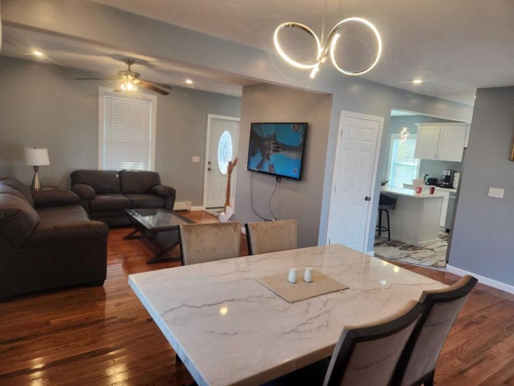 a living room with a dining table and a living room at Newly updated 3 bedrooms luxury house in Worcester