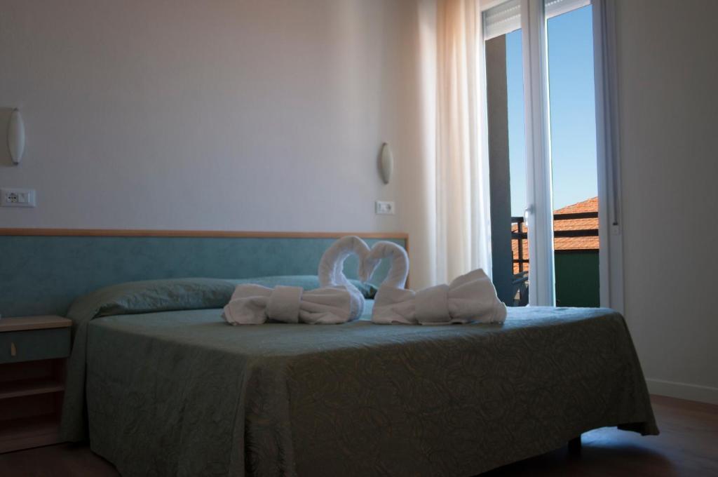 Postel nebo postele na pokoji v ubytování Hotel Ondina e Milazzo