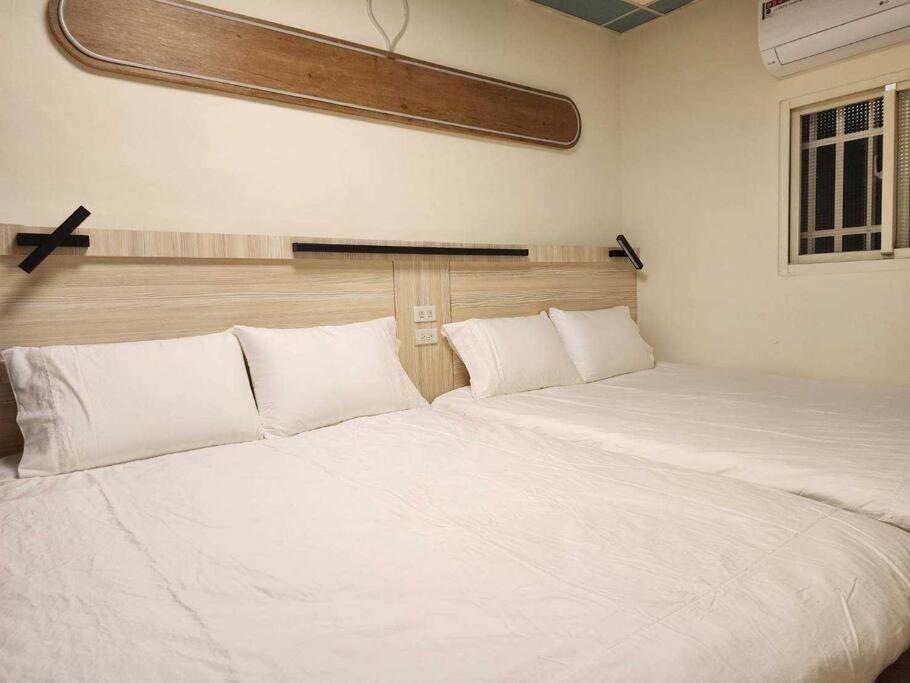 Voodi või voodid majutusasutuse BeiHe Village BnB toas