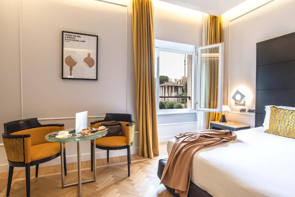 A bed or beds in a room at 47 Boutique Hotel