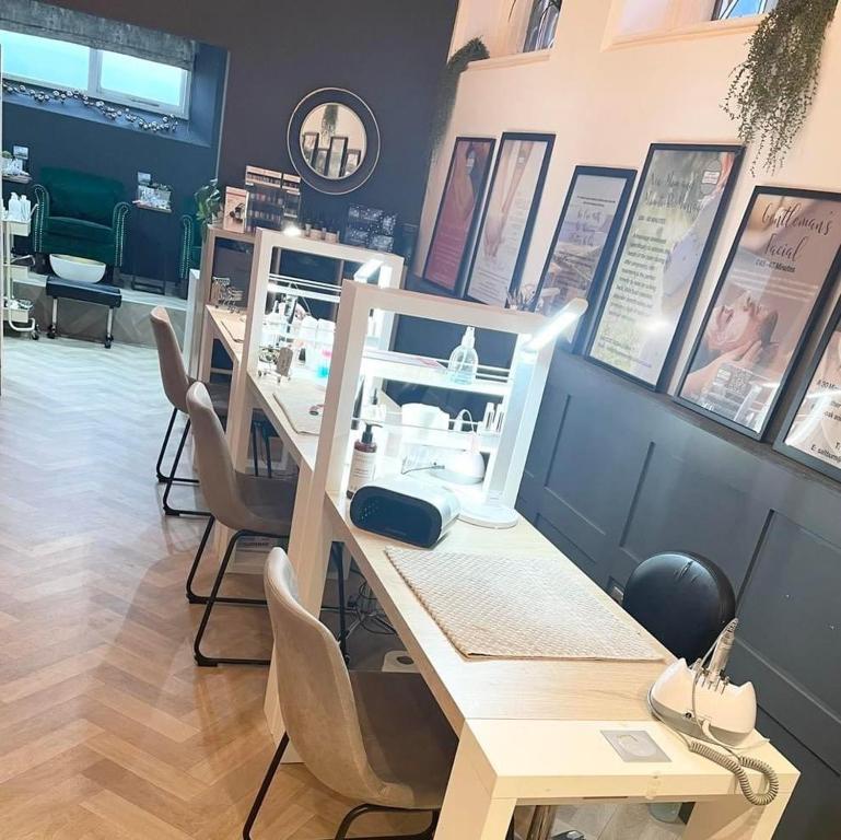 a salon with a table and chairs in a room at The Spa Hotel in Saltburn-by-the-Sea