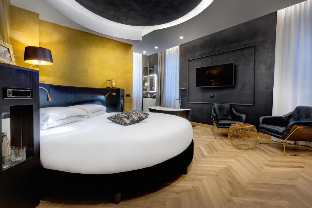 A bed or beds in a room at Dharma Boutique Hotel & SPA