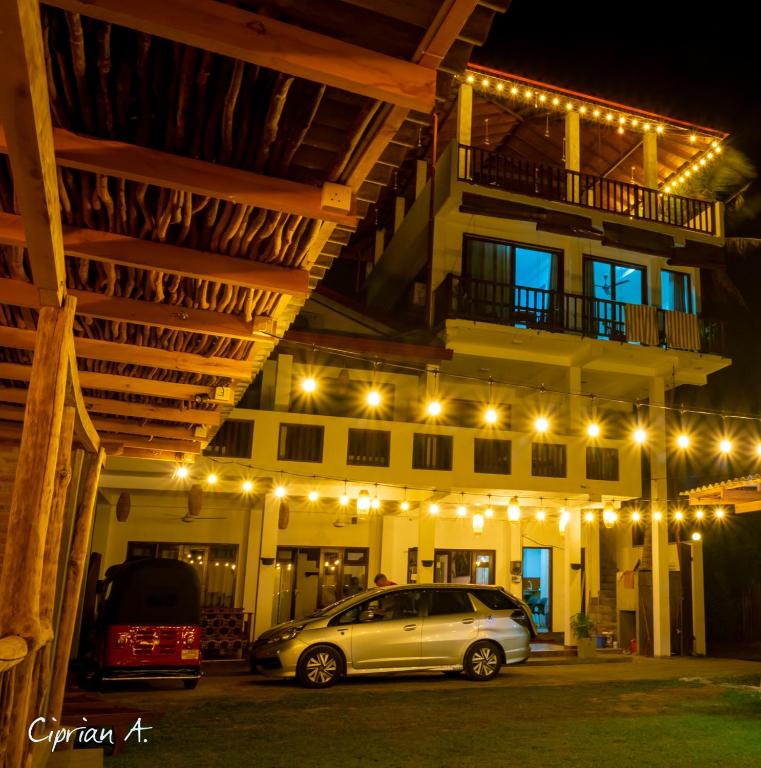 a car parked in front of a building at night at Chill House make a Good Story with infinite Ocean Surf and Stay in Weligama