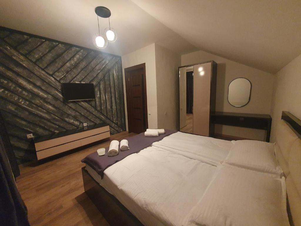 Postel nebo postele na pokoji v ubytování Gesh House
