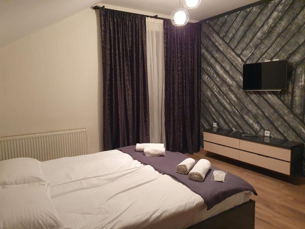 Postel nebo postele na pokoji v ubytování Gesh House