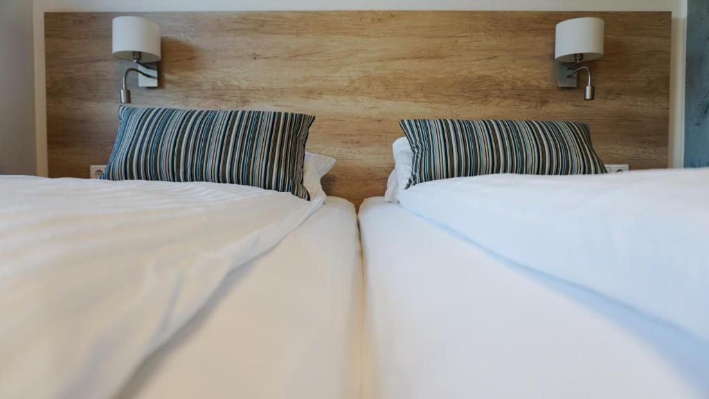 Postel nebo postele na pokoji v ubytování Motel Arctic Wind