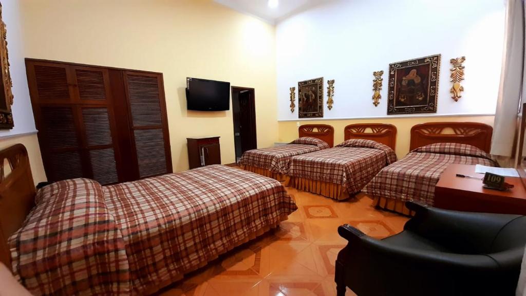Postel nebo postele na pokoji v ubytování Hotel Chucarima