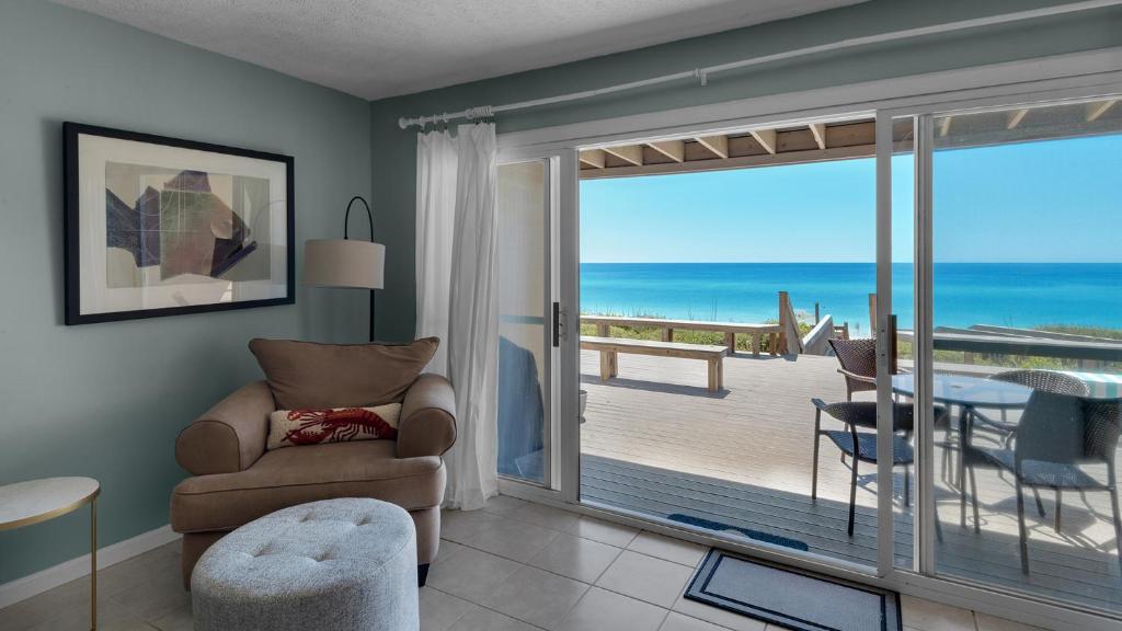 a living room with a view of the ocean at Blue Nine 5 in Panama City Beach