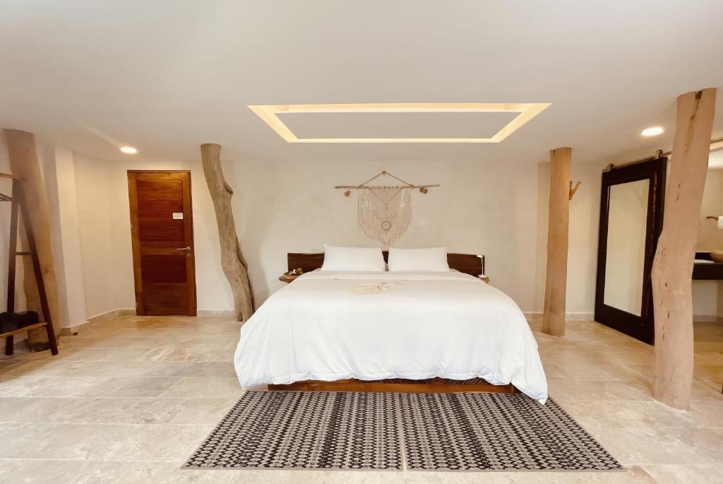 Postel nebo postele na pokoji v ubytování Akalki Hotel y Centro Holistico