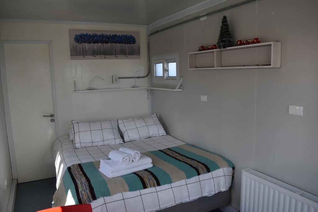 Postel nebo postele na pokoji v ubytování Container Departamento en Puerto Natales