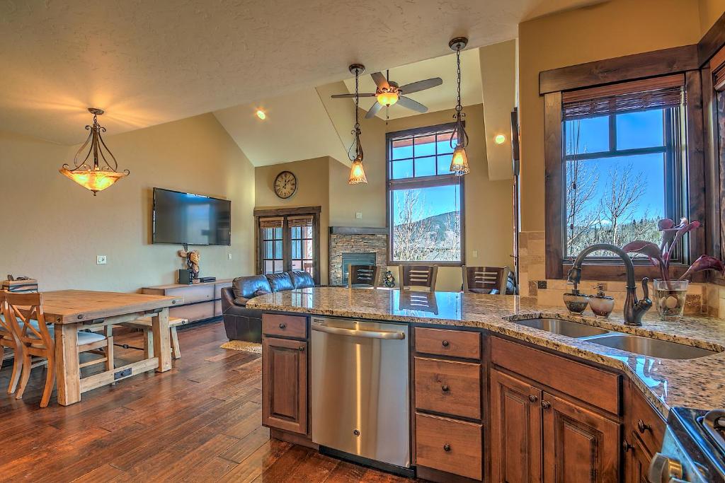a large kitchen with a table and a counter top at 5-Star Finishings Townhome, Minutes from World Class Ski Resorts, Hot Tub home in Silverthorne