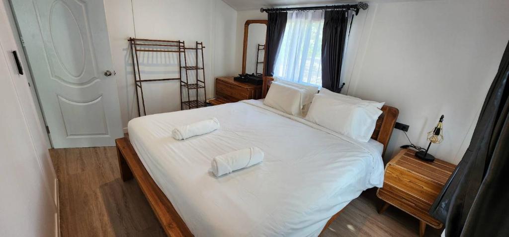 Postel nebo postele na pokoji v ubytování The Nidhra Boutique Resort