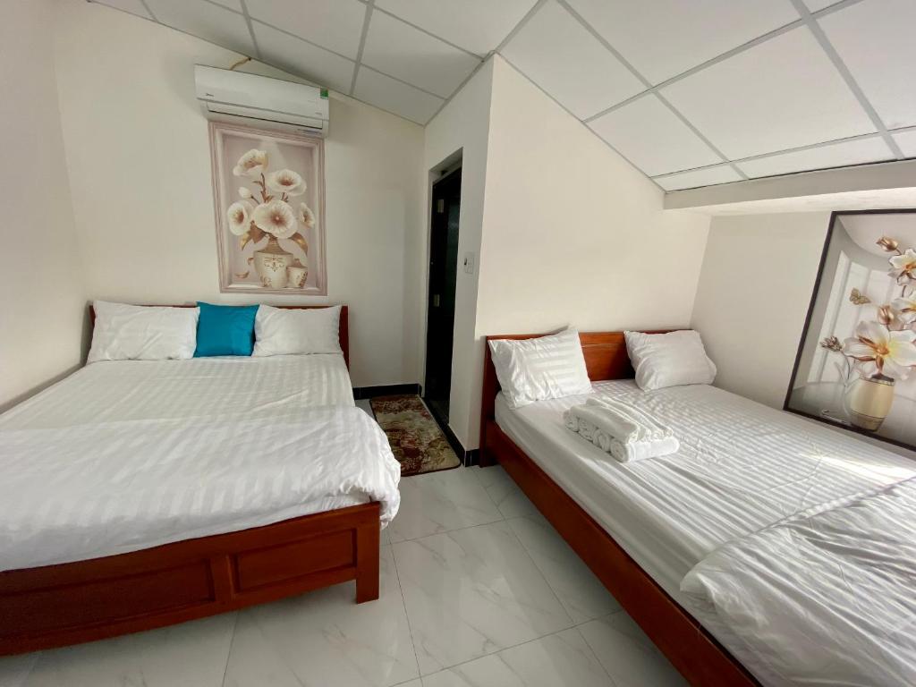 Postel nebo postele na pokoji v ubytování BOBE Homestay