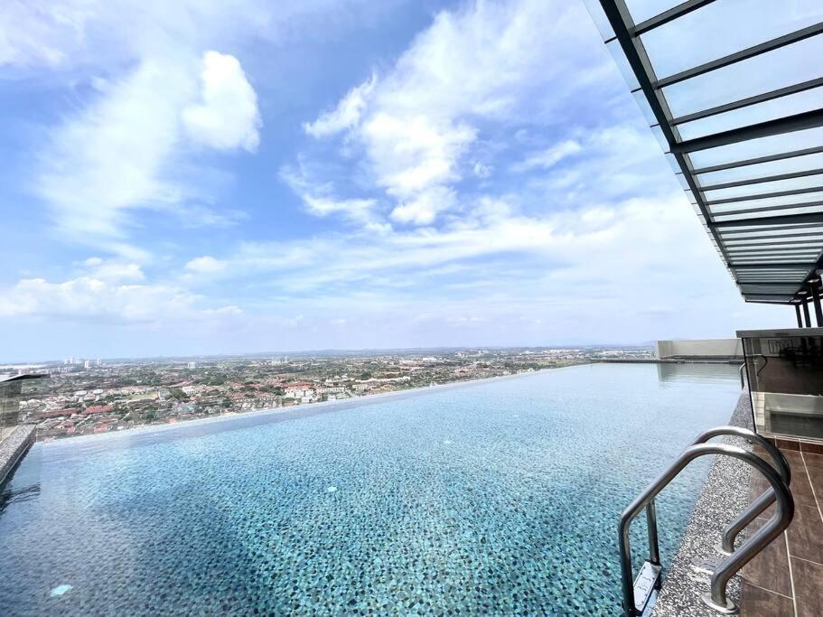 a view of a swimming pool on top of a building at Ins Suite @ The Quartz Residence-Infinity Pool in Melaka