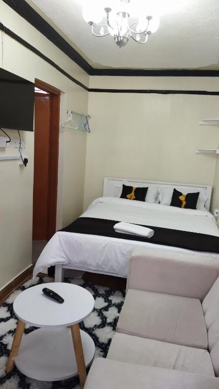 Postel nebo postele na pokoji v ubytování Essie towers accomodation