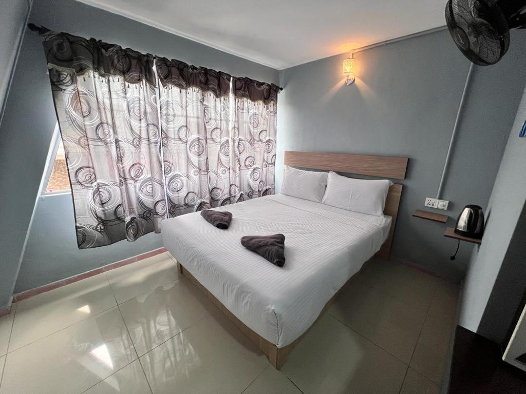 Katil atau katil-katil dalam bilik di Hotel Yasmin