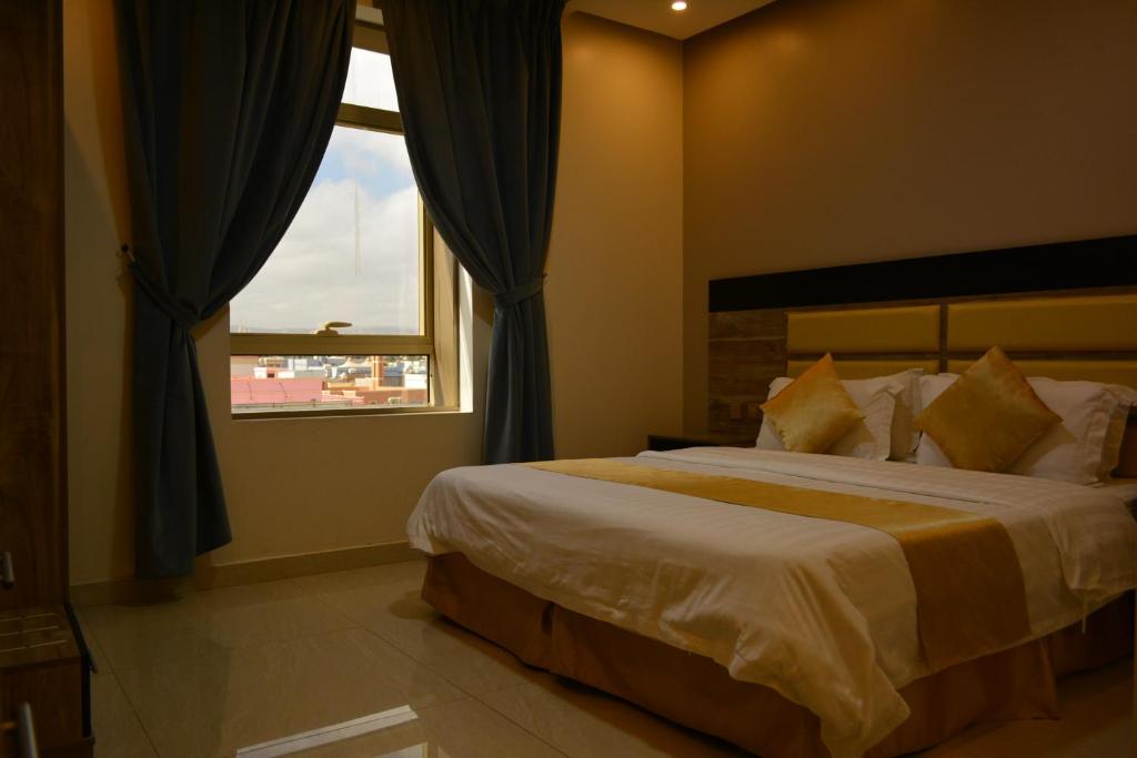 Un ou plusieurs lits dans un hébergement de l'établissement بيت الماس للشقق الفندقية MAAS House Apartments