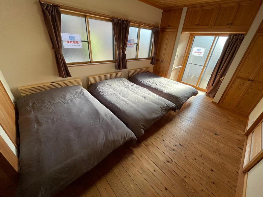 Postel nebo postele na pokoji v ubytování ARS Hotel Nikko Imaichi 一棟貸切