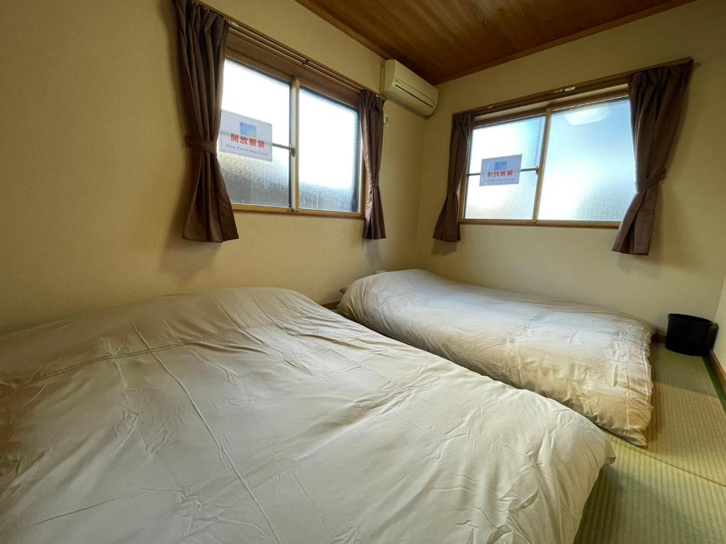 Postel nebo postele na pokoji v ubytování ARS Hotel Nikko Imaichi 一棟貸切