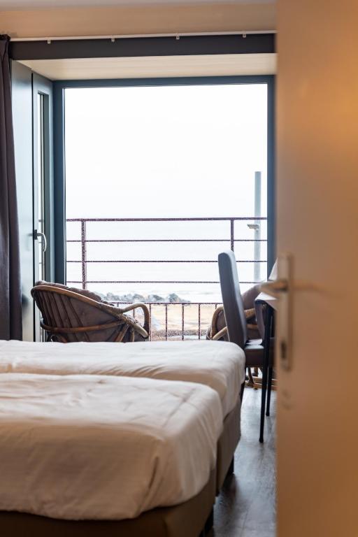 Postel nebo postele na pokoji v ubytování Hotel Les Mouettes