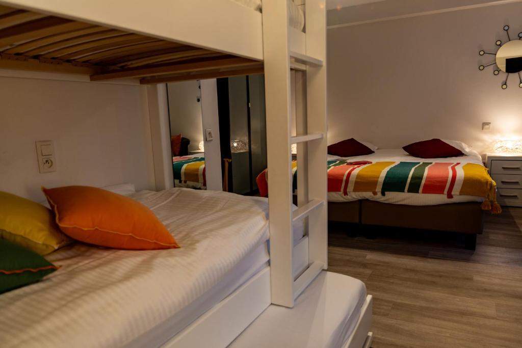 Postel nebo postele na pokoji v ubytování Hotel Les Mouettes