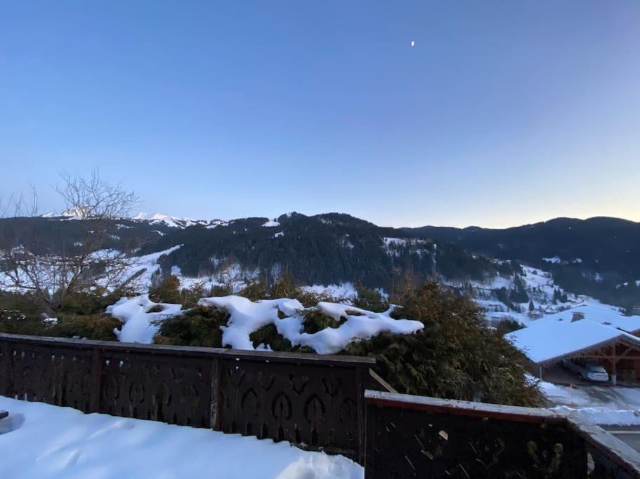 a view of a snow covered mountain with trees at Chalet Cosy Les Gets Vue Montagne in Les Gets