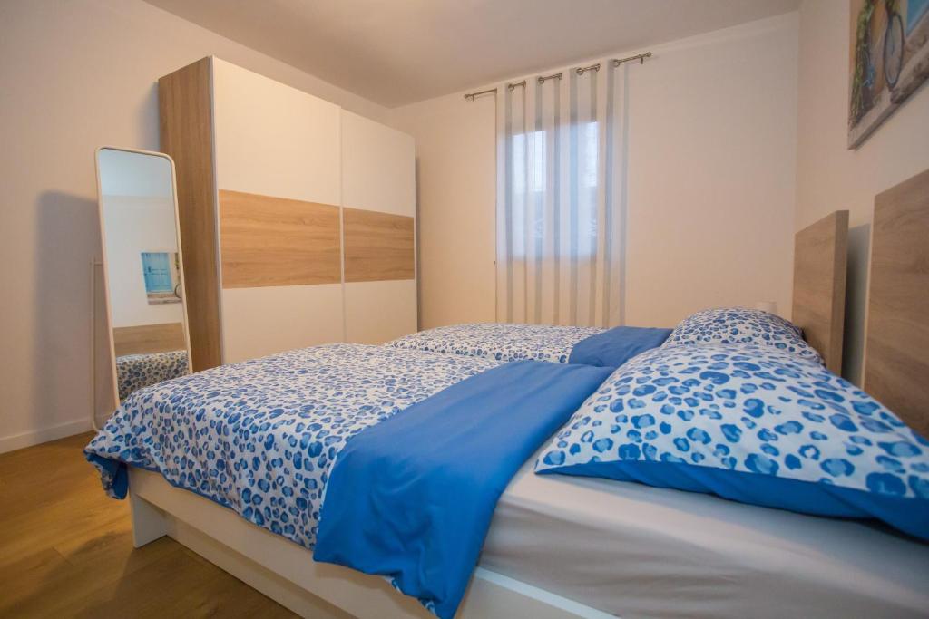 Posteľ alebo postele v izbe v ubytovaní Apartment Ivan 2